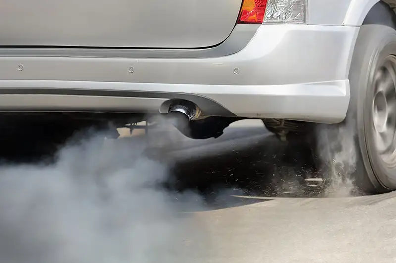 Exhaust fumes from car tailpipe