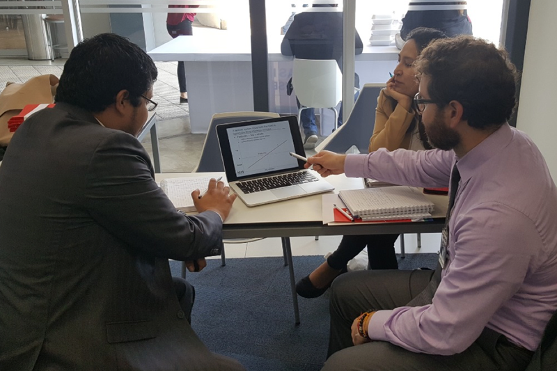 ICCT researcher Francisco Posada discusses fuel economy vehicle tax options with Luis Ibañes and Guiselle Castillo from Peru’s Ministry of Environment (MINAM).